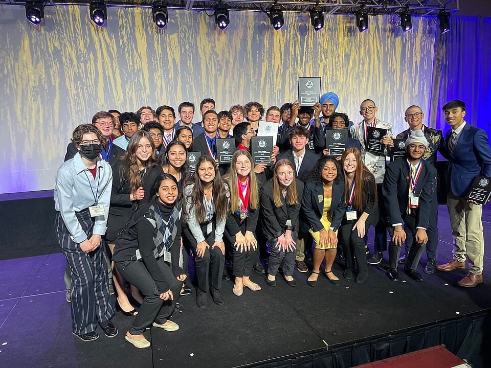 DECA students celebrating wins at a state career development conference
