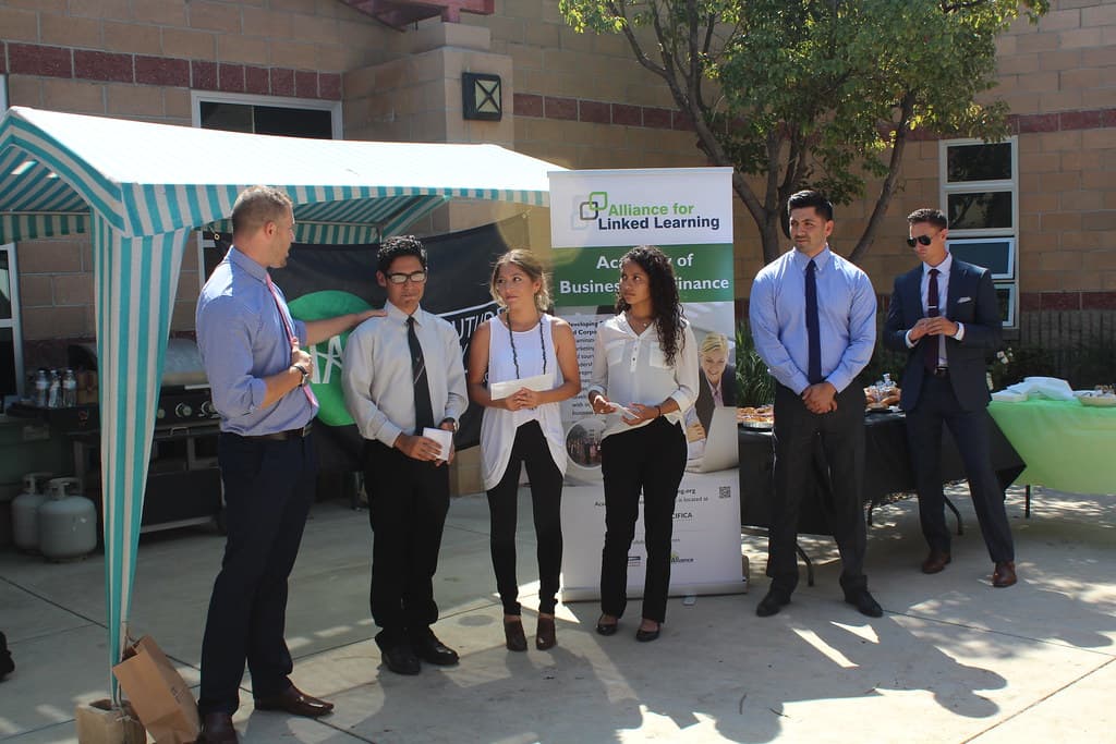Student presenting a startup idea at a pitch competition
