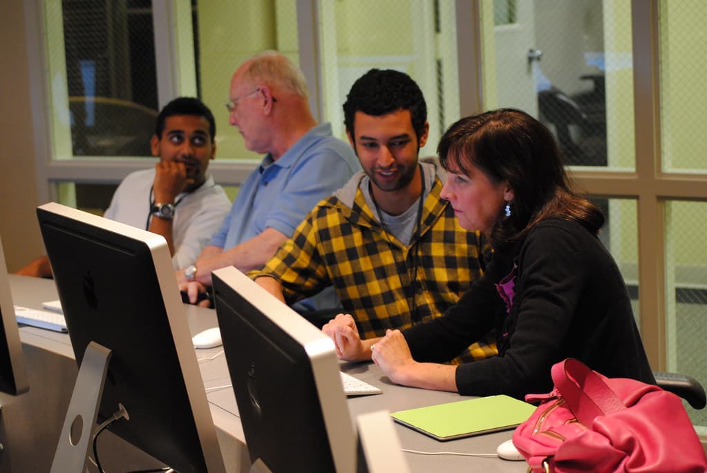 Students working in a computer lab at a coding education program