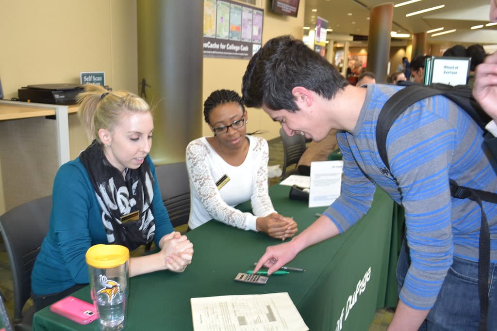 Students participating in a financial literacy workshop on budgeting and housing costs