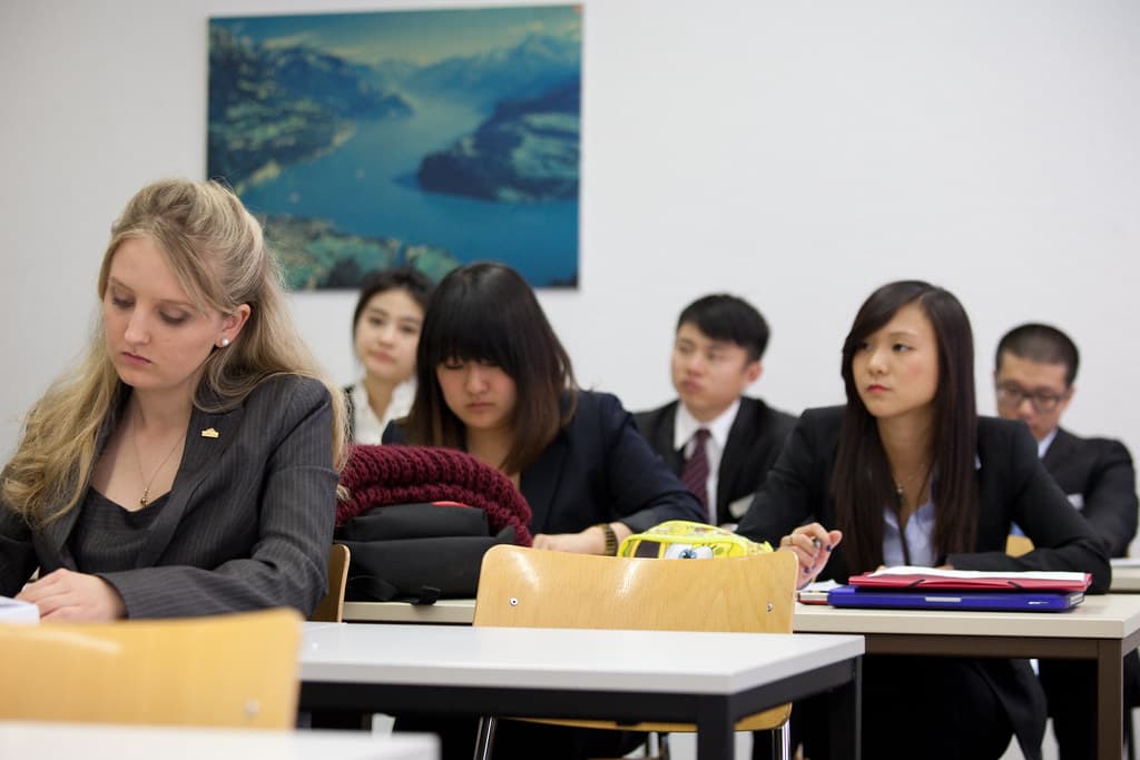 Students in a finance seminar learning about investing and portfolio management