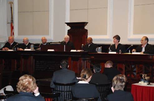 Students arguing before a panel of judges at a national moot court championship