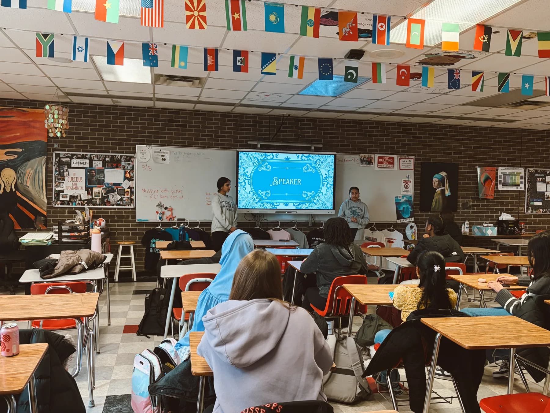 Students leading a Project EDSA chapter presentation in a classroom