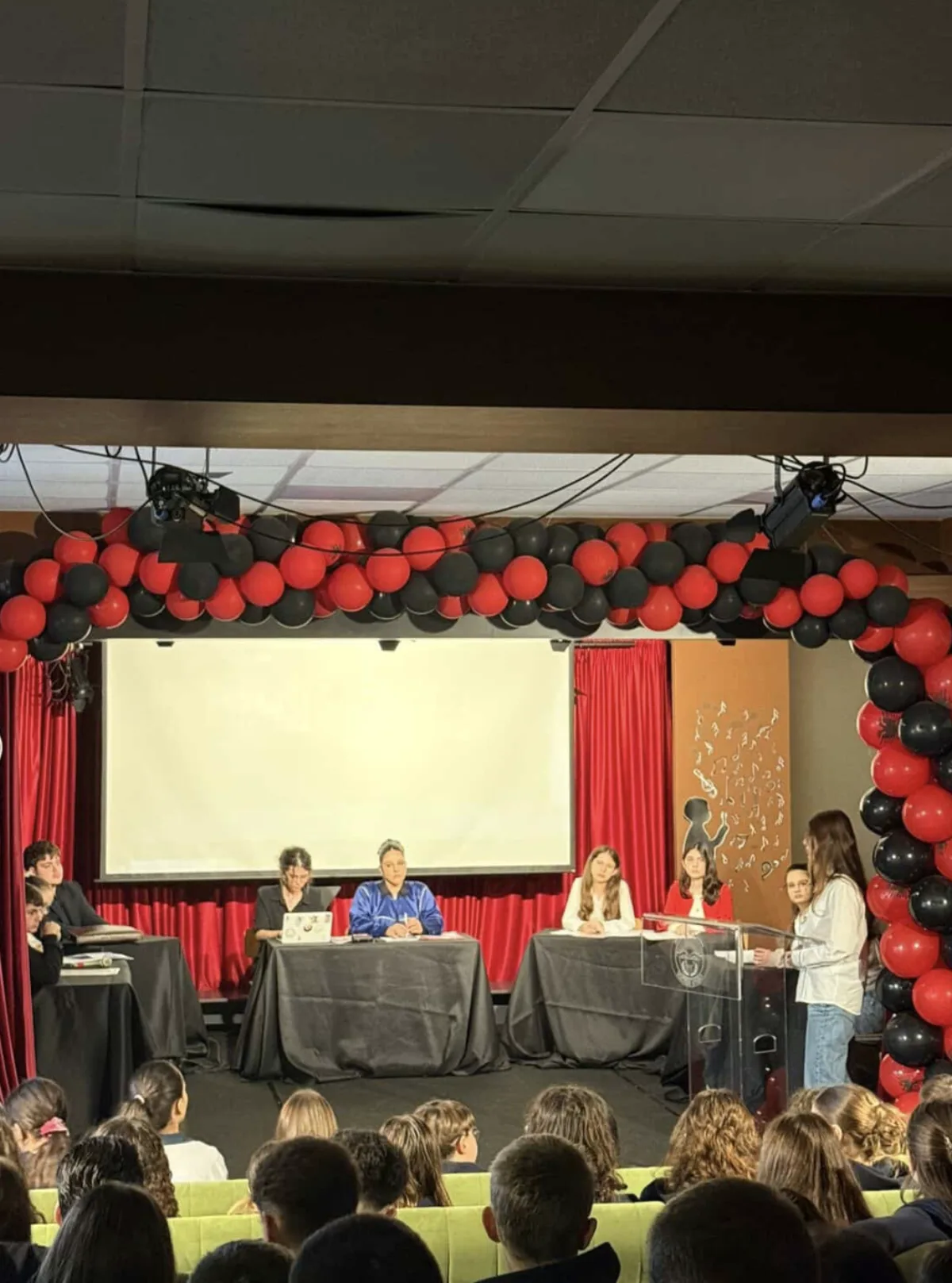 A student presenting to a school audience