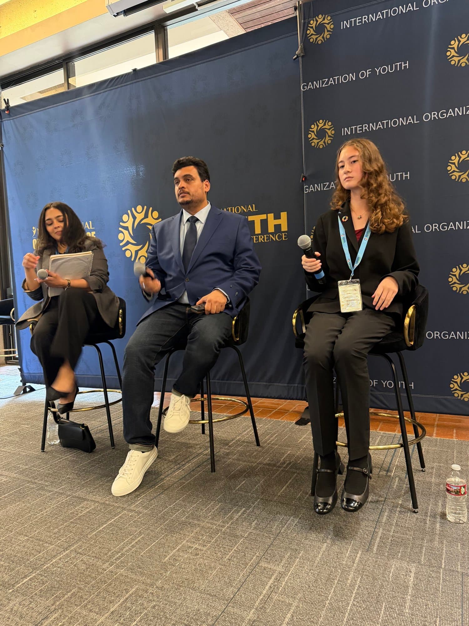 Young advocates speaking on a conference panel
