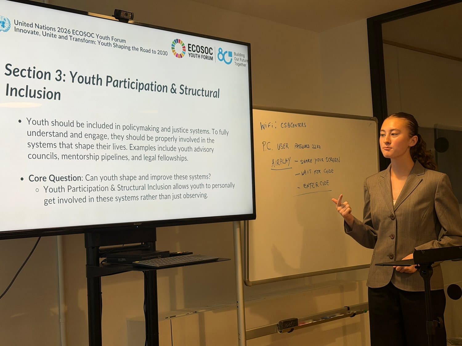 A young presenter explaining youth participation and justice systems